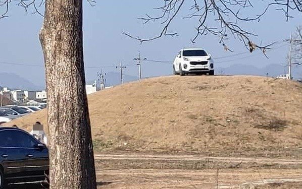 Someone in South Korea drives an SUV on the tomb of the royal family
