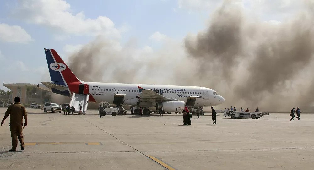 A violent explosion at Yemen's Aden airport and gunfire have killed 22 people and injured more than 50 people.