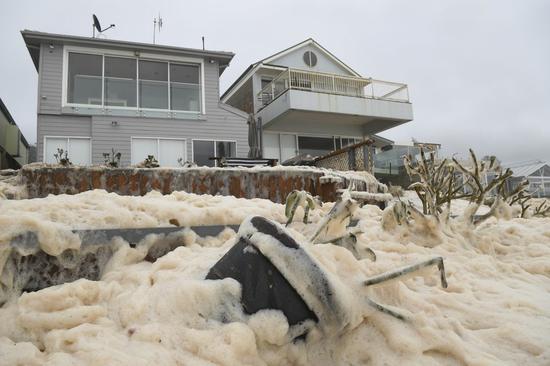 There is a lot of foam on Australian beaches. Local residents run naked in the rainstorm.