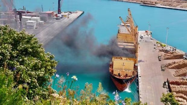 A cargo ship caught fire in Port Napier, North Island, New Zealand