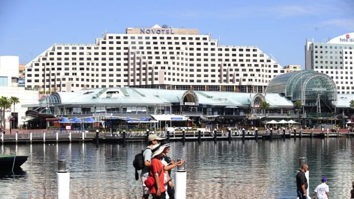 An employee of a quarantined hotel in Sydney is infected with the novel coronavirus, the first case in NSW in 25 days.