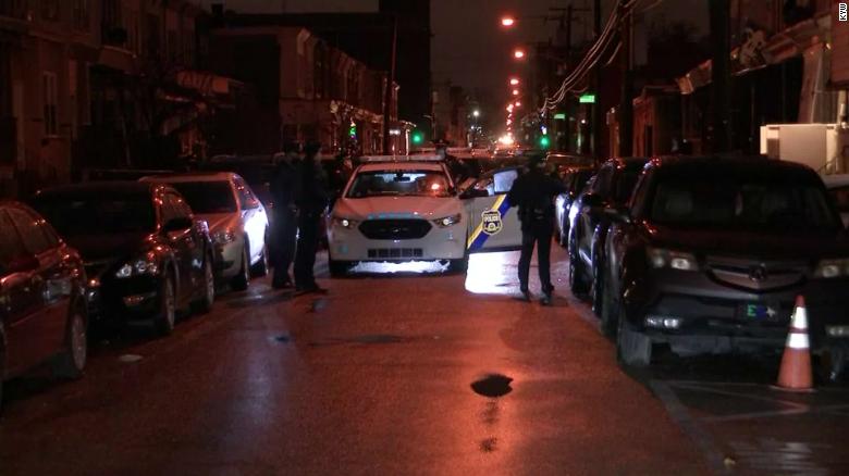 A gunman in Philadelphia, USA, hit two teenagers in the street, killing one person. Police killed the gunman.