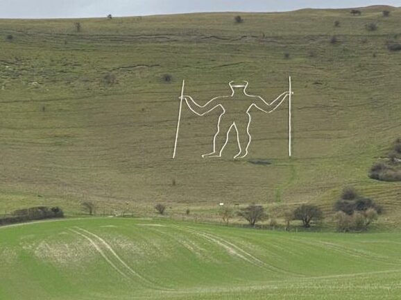 British mysterious giant stone carvings were painted with masks. Police searched for saboteurs.