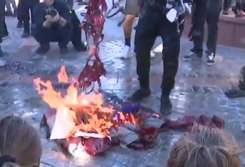 Biden's inauguration day, protesters burned flags outside the state legislature.