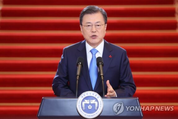 Moon Jae-in apologizes for soaring house prices and promises to give South Koreans free coronavirus vaccines.