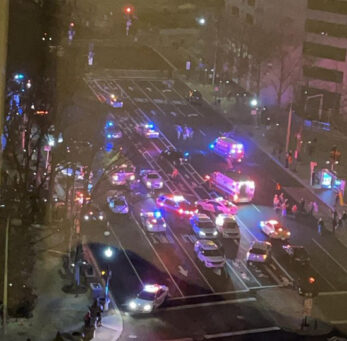 An American man was stabbed outside the Trump Hotel. A large number of police cars were dispatched