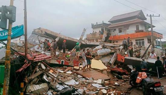 Indonesia's 6.2-magnitude earthquake has killed 26 people, and a local hospital has been razed to the ground.