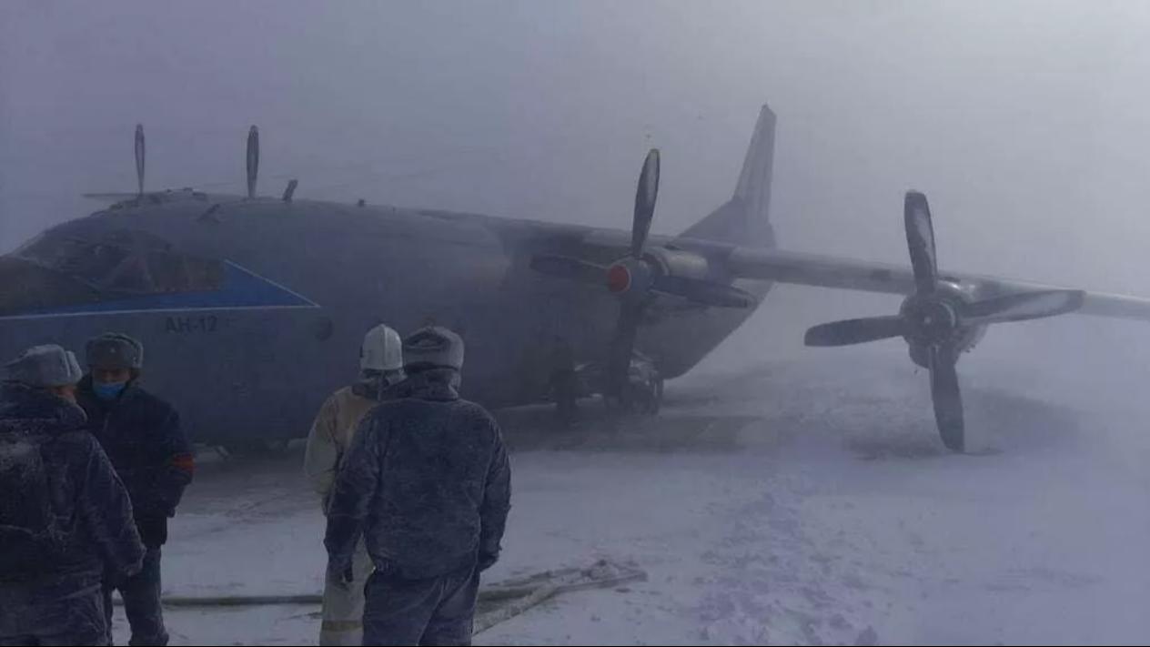 An-12 military transport plane in the Russian Far East crashed into a guardrail when landing.