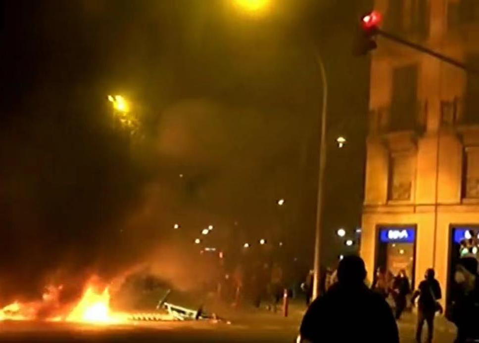 Spanish protest singer arrested for four days. Demonstrators burned roadblocks and destroyed buildings.