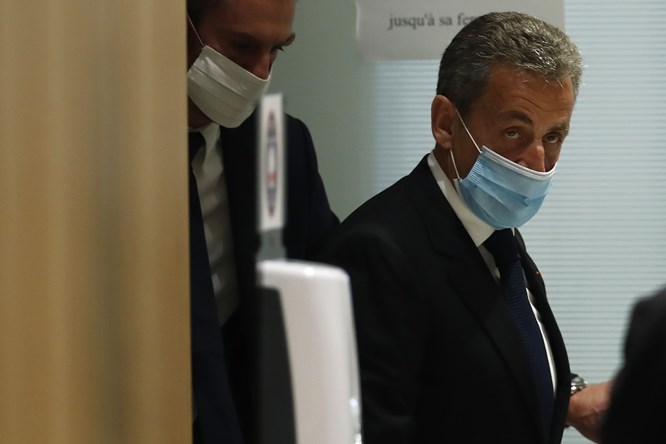 Former French President Sarkozy was sentenced to three years in prison for corruption. Lawyers said they would appeal.