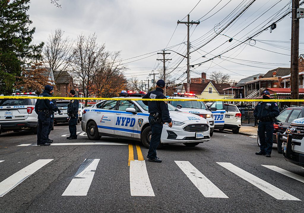 A passerby was shot in the arm after a sudden gunfight on the streets of New York, killing 1 and injuring 2 others.