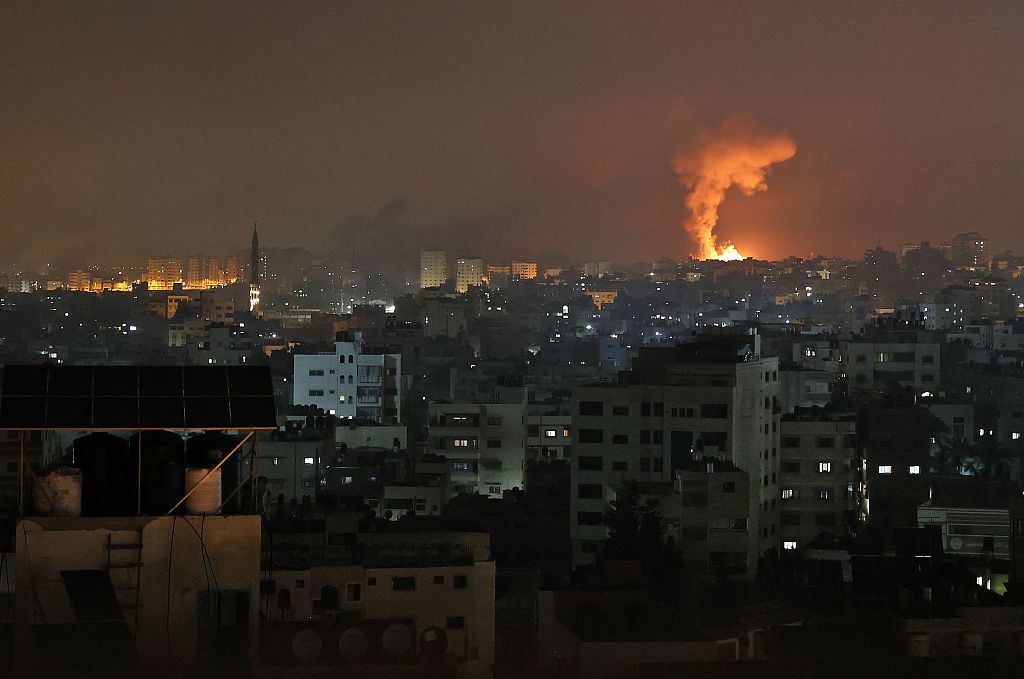 Hamas fired dozens of rockets into central Israel to warn of air strikes in the Gaza Strip