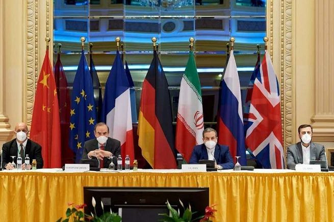 Iran has called on the united states and europe to lift sanctions to ease the global energy crisis