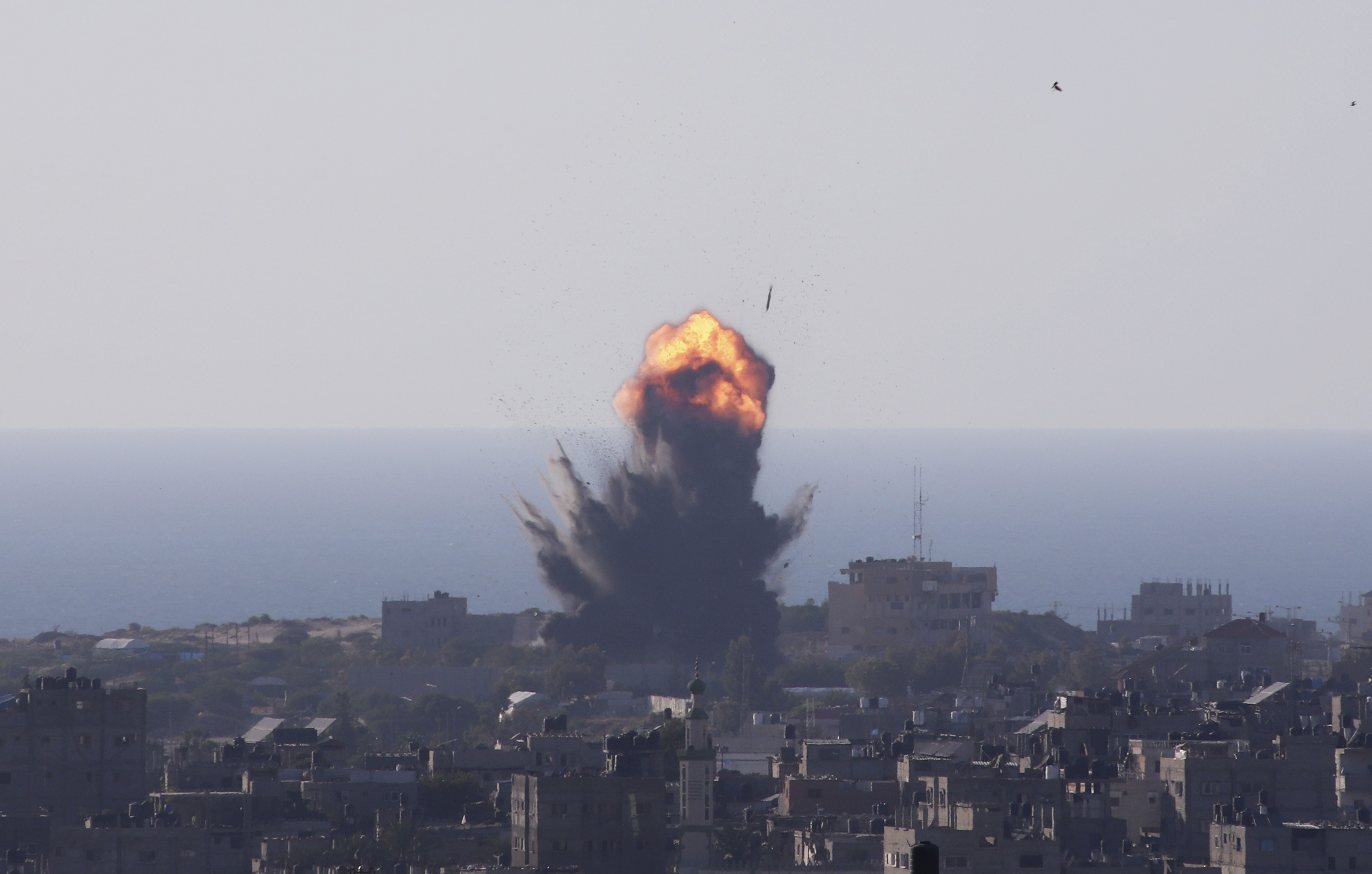 Israeli forces and Gaza armed groups continued to exchange fire in the southern port of explosions