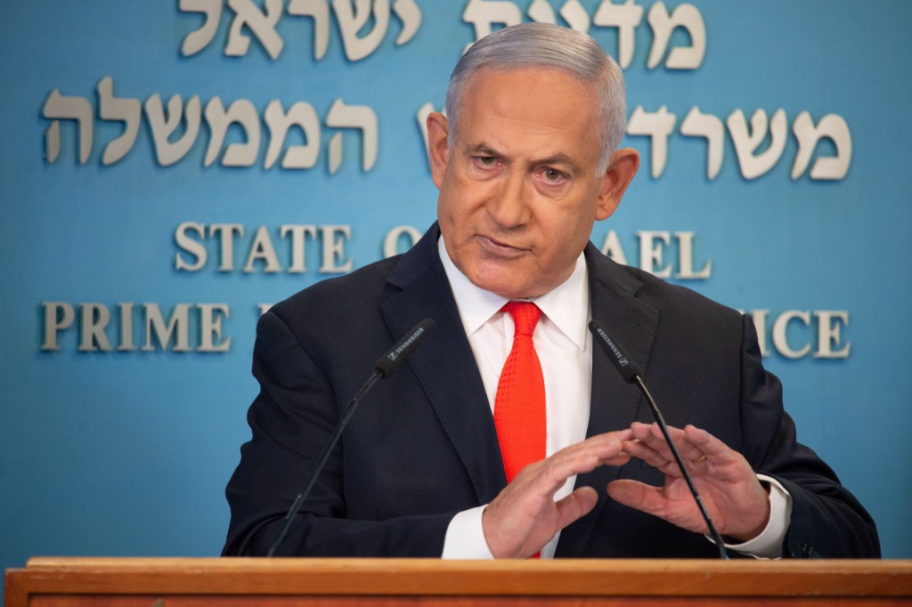 Israel's prime minister has warned Hamas to abide by the cease-fire